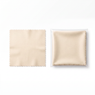 A light beige microfiber cleaning cloth with serrated edges shown next to its clear plastic packaging containing a matching folded cloth, on a solid white background.