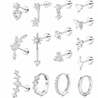 A collection of silver-toned stud earrings and huggie hoop earrings with clear cubic zirconia stones, arranged in a grid on a white background. Designs include heart, star, leaf, and geometric motifs.