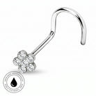 A curved silver-toned nose barbell stud with a flower-shaped cluster of clear gemstones, shown on a white background with a circular 'Skin Safe Waterproof' badge in the lower-left corner.