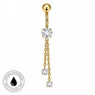 Gold-plated navel piercing barbell with a ball top, a central clear cubic zirconia stone, and three dangling chain sections ending in smaller clear stones. A circular 'Skin Safe Waterproof' badge is shown in the bottom-left corner on a plain white background.