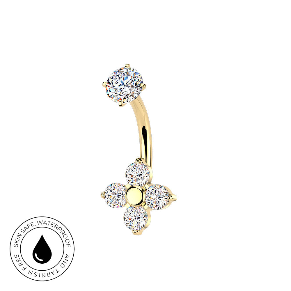 A curved barbell belly button ring in yellow gold, decorated with a round clear gemstone at the top and a four-petal flower cluster at the bottom. The image features a 'Skin Safe Waterproof' badge in the bottom-left corner on a solid white background.