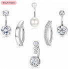 Six silver-toned belly button piercings arranged on a white background, including round clear stone studs, a pearl barbell, curved huggie-style pieces with stones, and a smaller cluster stud. A pink label in the top left reads 'MULTI PACK'.