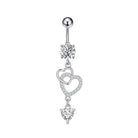 A silver-toned belly button ring featuring a ball top, a round clear gemstone, and three dangling heart charms adorned with small clear stones, shown on a plain white background.