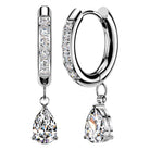 A pair of silver hoop earrings with clear gemstones, featuring a vertical bar with round stones, a curved hoop with round stones, and pear-shaped drop gemstones, shown on a white background.