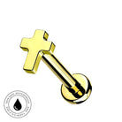 A gold-plated labret piercing stud with a cross-shaped top and a round flat-back post, shown on a plain white background with a circular 'Skin Safe Waterproof' badge in the lower-left corner.