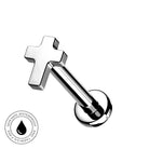 A silver-toned stainless steel labret piercing stud with a cross-shaped top and a round flat-back post, shown on a plain white background with a circular 'Skin Safe Waterproof' badge in the lower-left corner.