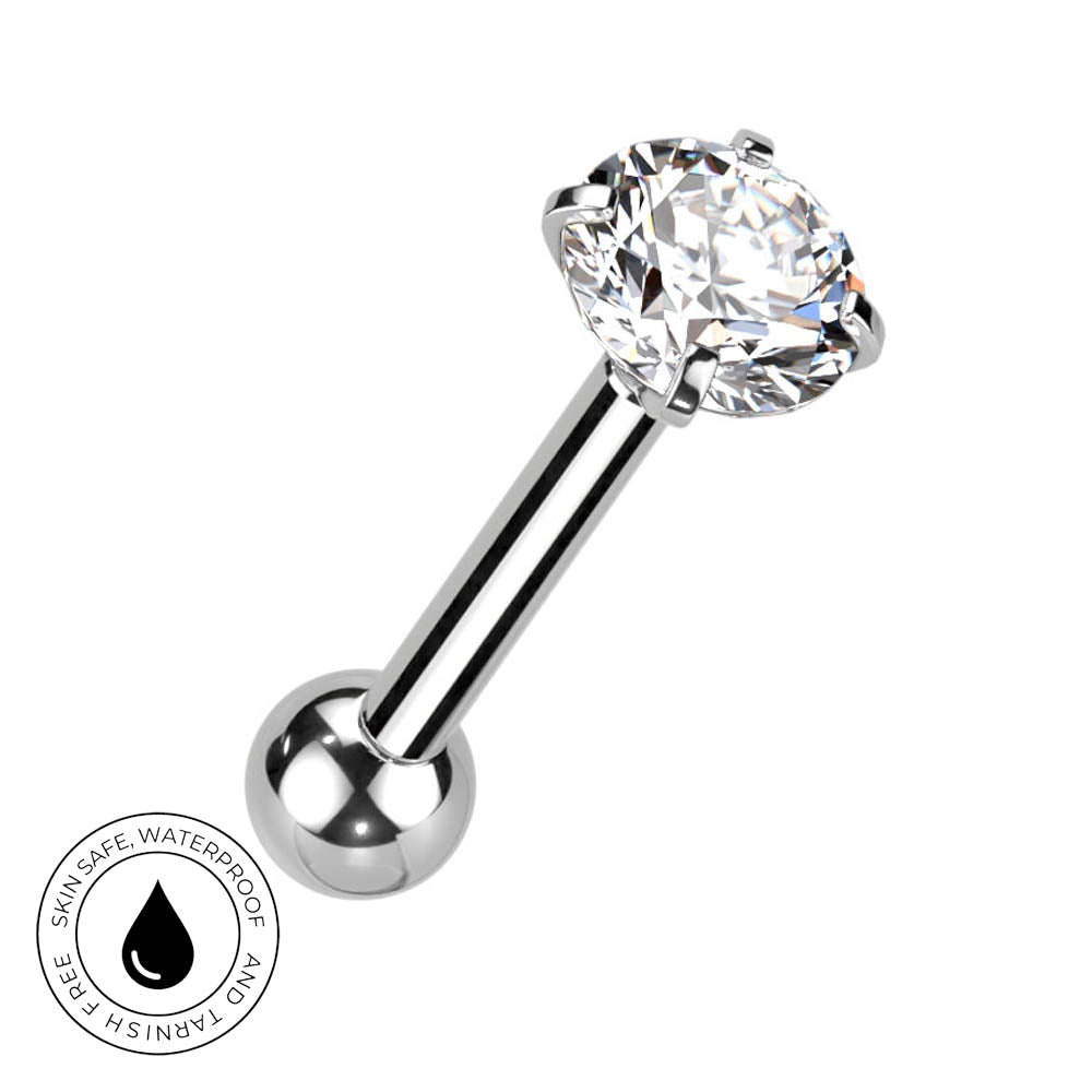 A silver-toned labret piercing barbell with a large, round-cut clear gemstone in a prong setting and a smooth ball end. A circular 'Skin Safe Waterproof' badge is shown in the bottom-left corner on a plain white background.