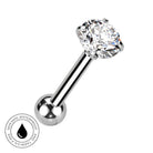 A silver-toned labret piercing barbell with a large, round-cut clear gemstone in a prong setting and a smooth ball end. A circular 'Skin Safe Waterproof' badge is shown in the bottom-left corner on a plain white background.